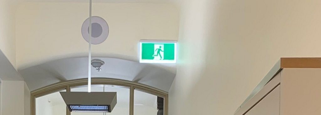 Safety Path Hybrid LED Exit Sign in corridor of heritage Milton House