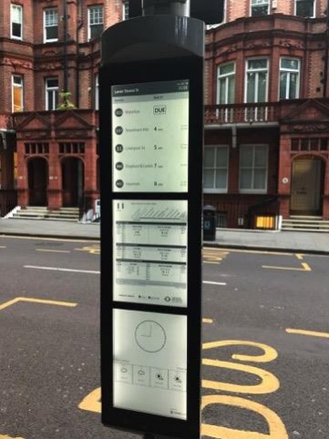Backlit Papercast E-Paper real-time Information Timetable on a bus stop in London, England in daytime